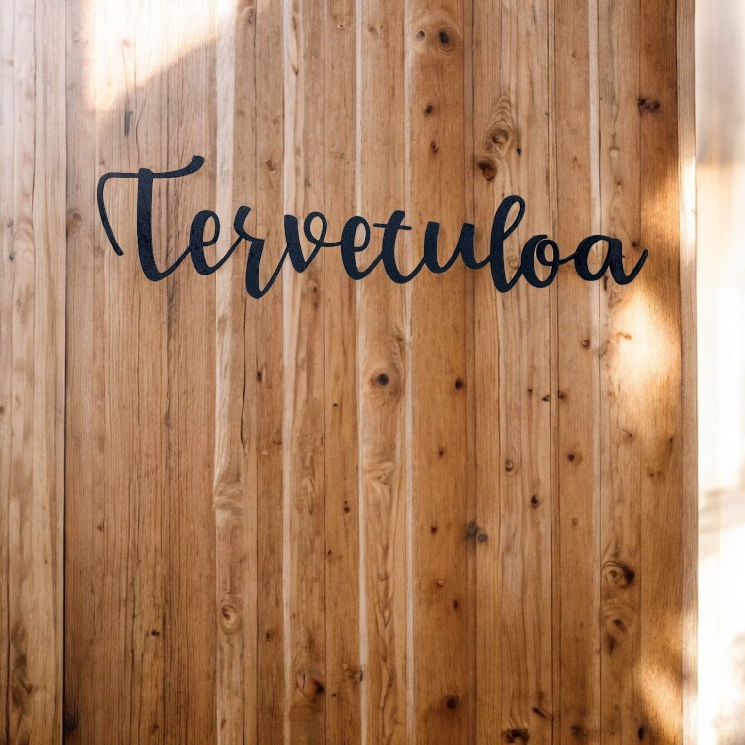 Tervetuloa-kyltti musta